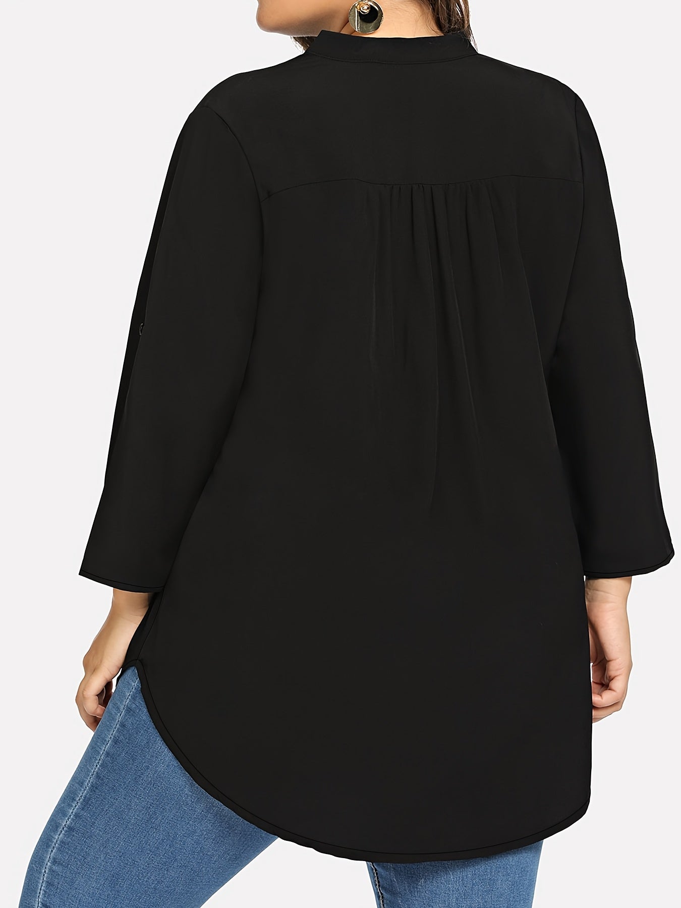 Women's plus size V-neck tunic top with long sleeves. Made of solid color polyester blend in a loose fit style, featuring a front short back long design with an H-line silhouette suitable