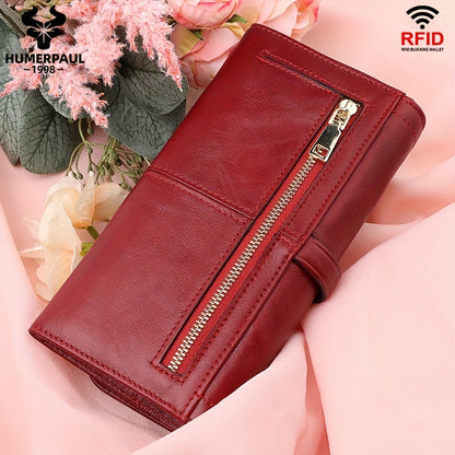 Red RFID blocking long clutch wallet with snap closure, zipper, coin pocket, and multiple card slots.