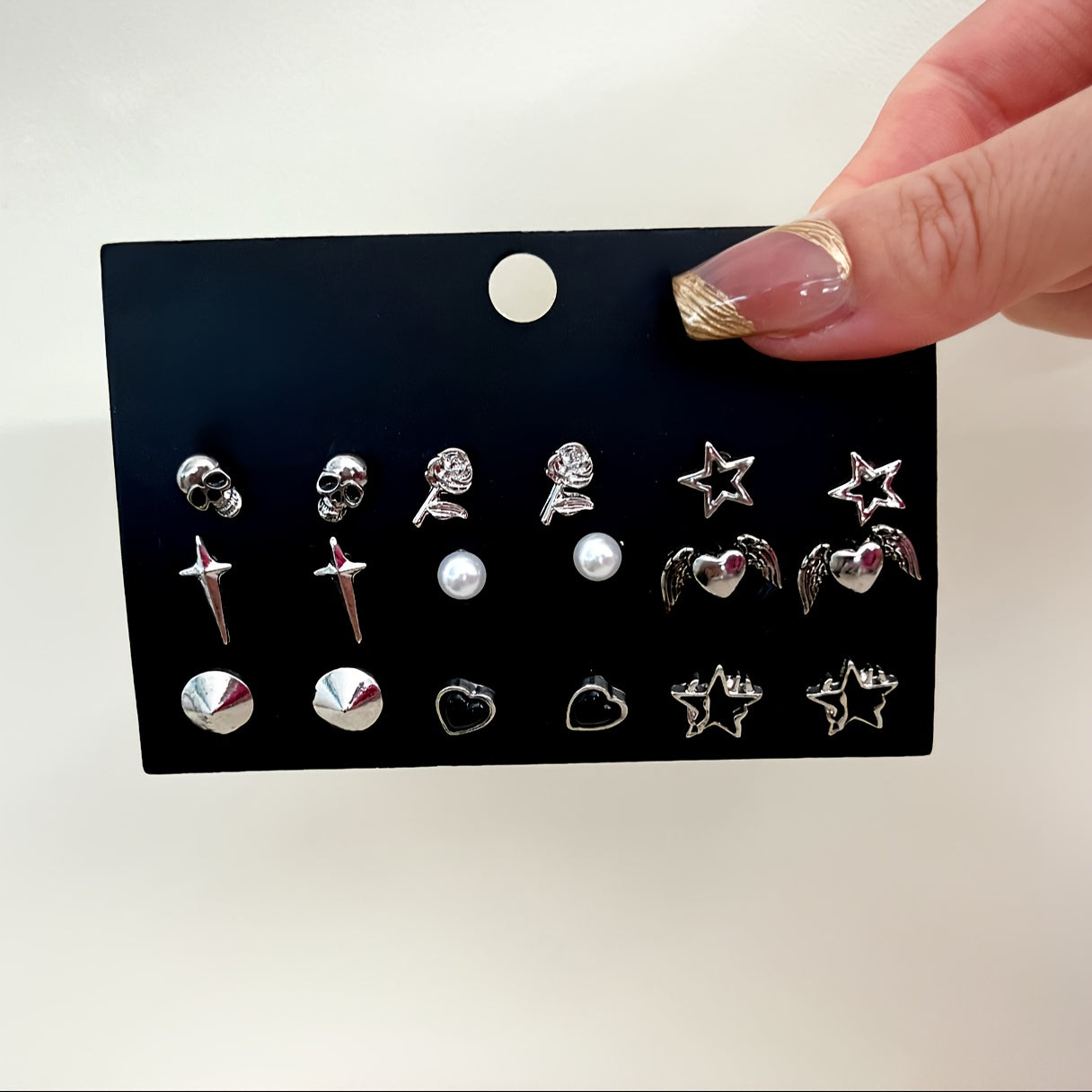 Vintage Gothic Earrings Set featuring 9 pairs, with designs inspired by skulls, roses, stars, hearts, and wings made from zinc alloy. Perfect for daily wear or parties, these earrings are a high aesthetic addition to any outfit. Makes a great Valentine's