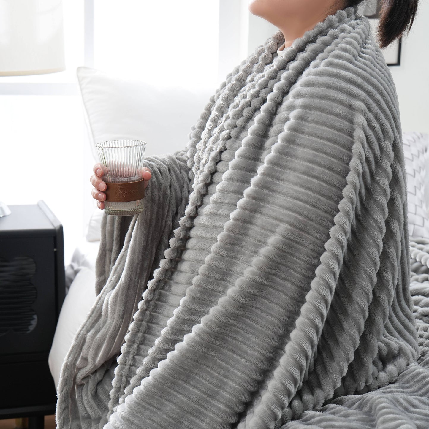 Enjoy the cozy comfort of our 1 piece 220GSM Flannel Throw Blanket, featuring a soft and warm ribbed design available in Beige, Gray, Black, or White. Perfect for all seasons, this blanket is ideal for use in the bedroom, sofa, office, or even for your