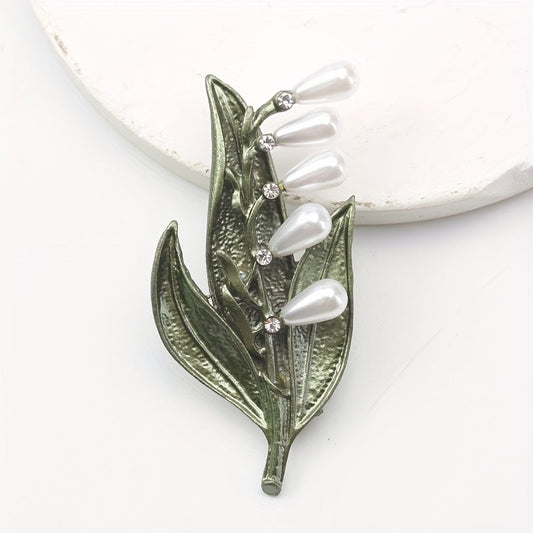 Vintage-inspired Enamel Leaf Brooch adorned with Imitation Pearls and Sparkling Rhinestones. This versatile and elegant fashion accessory is suitable for both men and women, adding a touch of sophistication to any outfit. Can be worn as a button or a