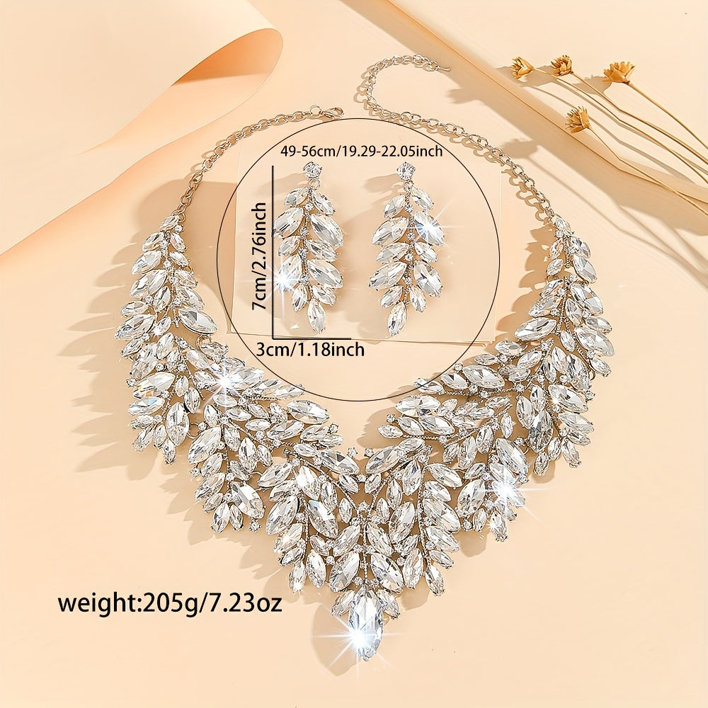 Luxurious wedding jewelry set crafted with fine materials and adorned with shimmering artificial crystals. This exquisite 3-piece set includes a necklace and earrings, perfect for weddings and special events. A timeless gift for any occasion, making it