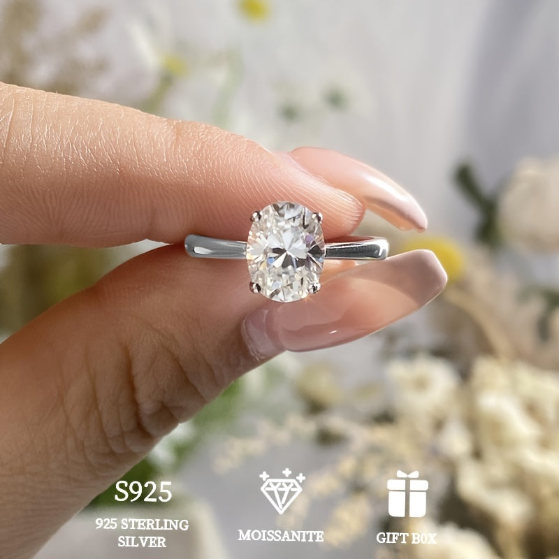 A hypoallergenic wedding or engagement ring gift for women, featuring a 2 carat goose egg Moissanite stone set in a classic four-prong 925 Sterling Silver ring. Includes Moissanite certificate and comes in an exquisite gift box.