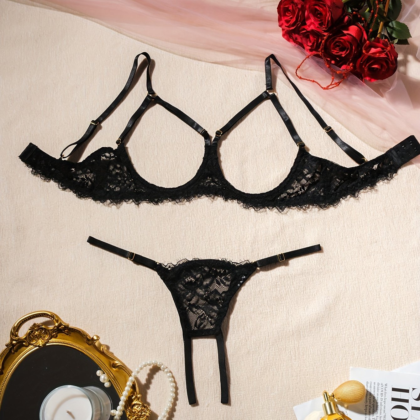 Women's sexy clothing set with open bust bra, open crotch thong, and floral lace design.