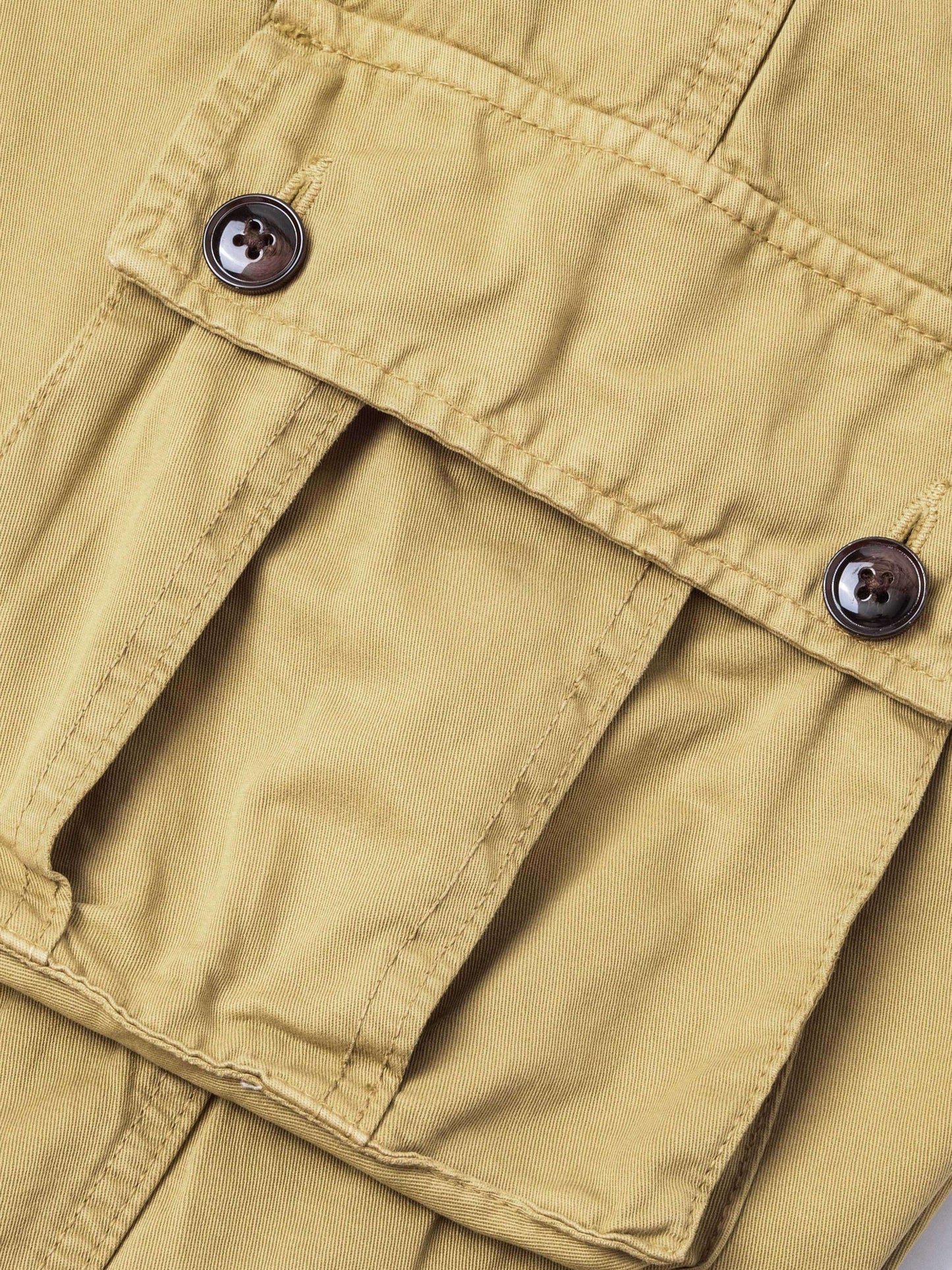 Men's plus size cargo pants in solid color, loose fit, made of washed cotton for all-season wear. Features 8 pockets and a street style design.