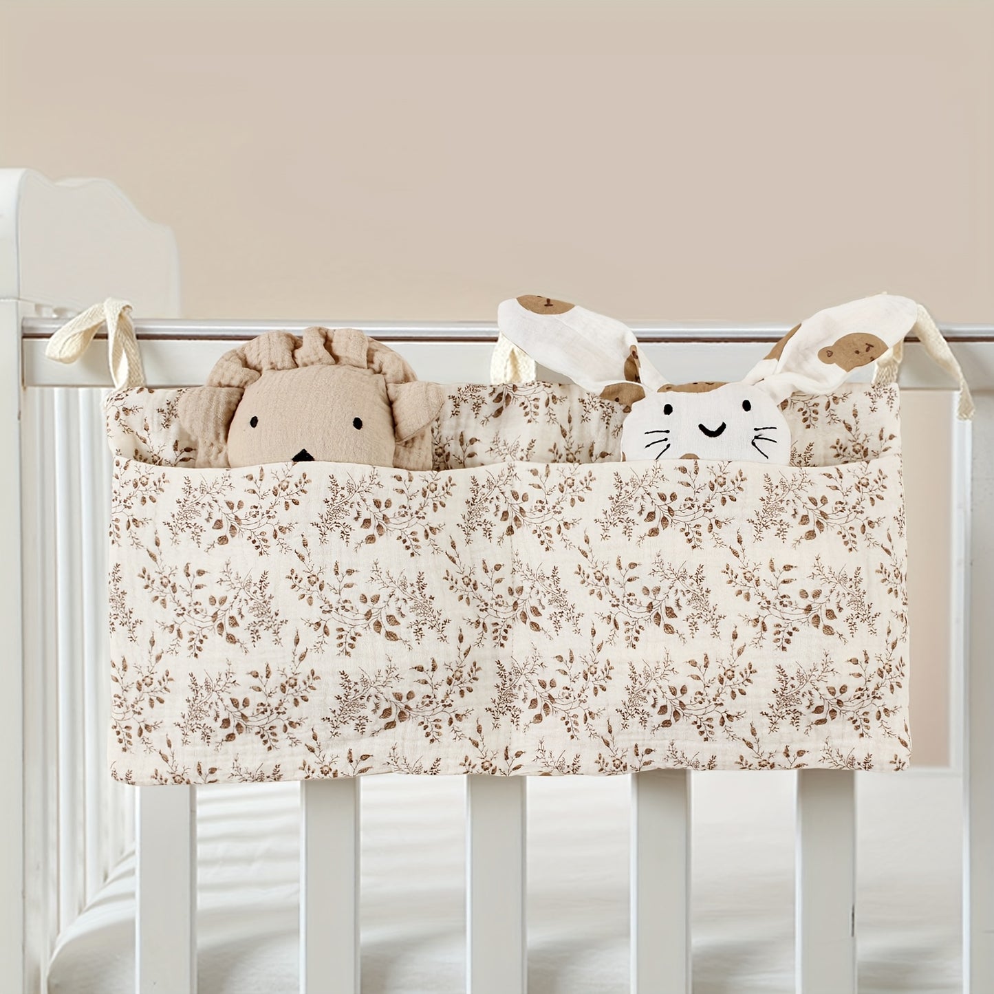 Double-layer fabric hanging storage bag with two stroller pockets, ideal for holding baby bottles with printed patterns.