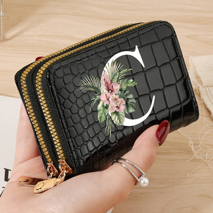 Women's credit card wallet with elegant floral letter print in black & white. Features large capacity, dual zipper, crocodile texture PU, lightweight design with nylon lining for everyday