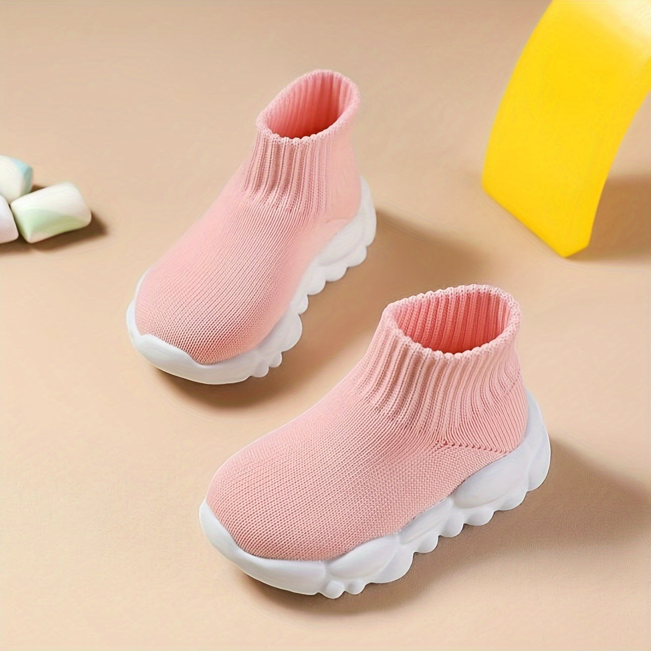 Breathable slip-on woven shoes for baby girls, ideal for walking or running.