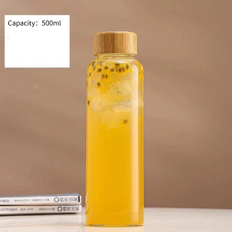 This borosilicate glass bottle comes with both a stainless steel lid and a wooden bamboo lid, making it perfect for travel and storing a variety of beverages such as juice, smoothies, kombucha, kefir, and tea. It is 100% leakproof and can be safely used