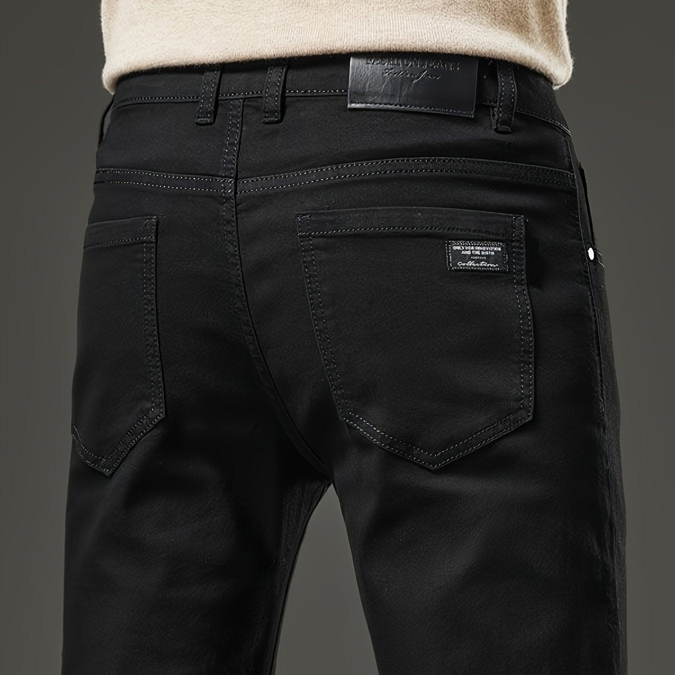 Slim fit men's jeans made of stretch denim in a solid color with washed details, suitable for year-round wear.