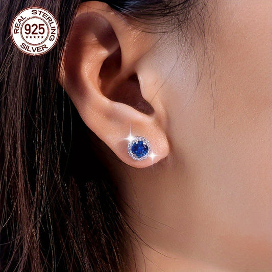 A beautiful pair of royal blue Tanzanite stud earrings in an elegant vintage style. Made from 925 sterling silver and featuring synthetic stones, these earrings are hypoallergenic and perfect for special occasions like weddings, gifting, Valentine's Day