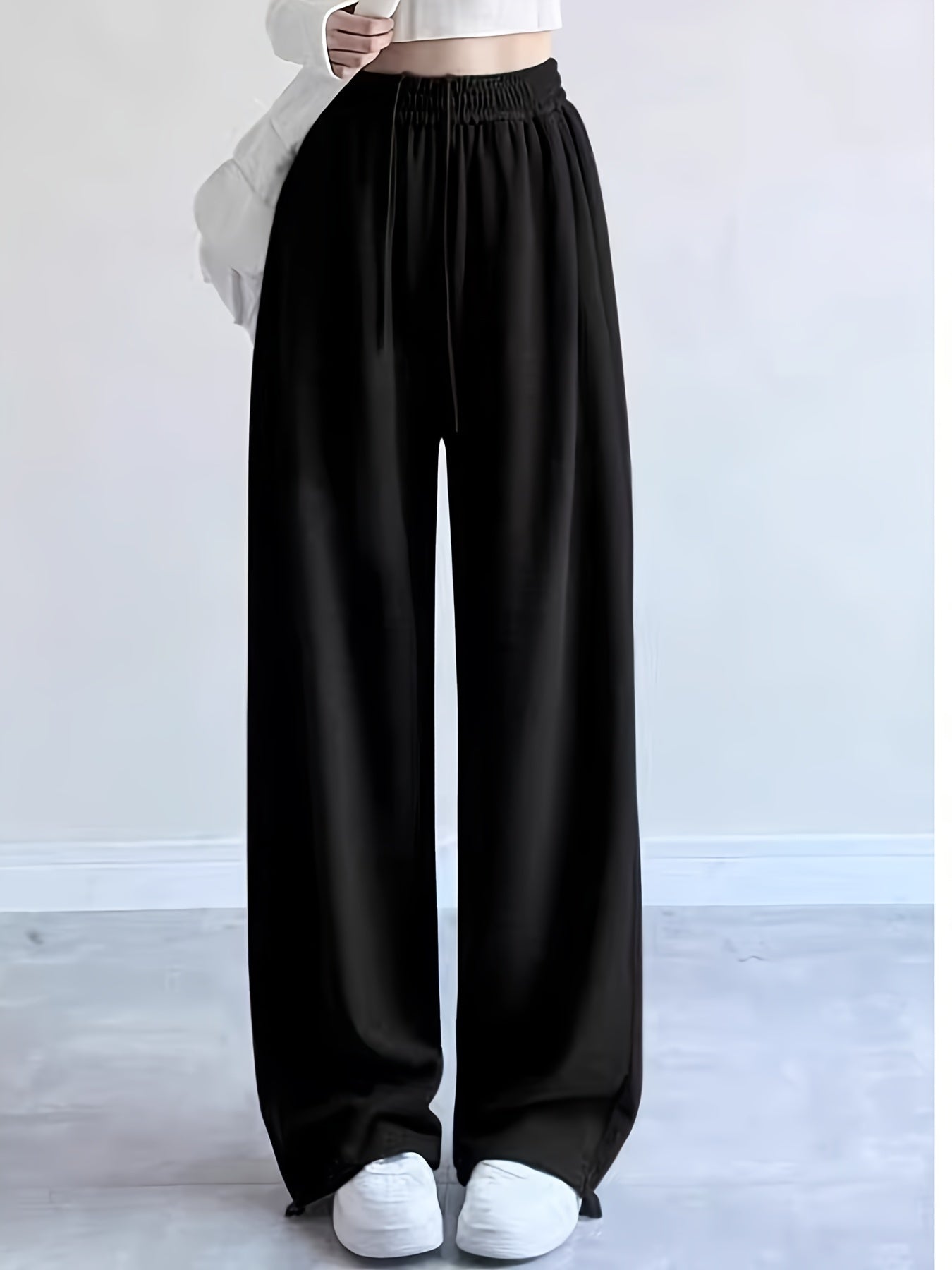 Introducing our new Youthful Wide-Leg Sweatpants for Spring/Summer 2024: made from a polyester blend, micro-elastic, solid color, long length, with pocket detail, loose fit, and suitable