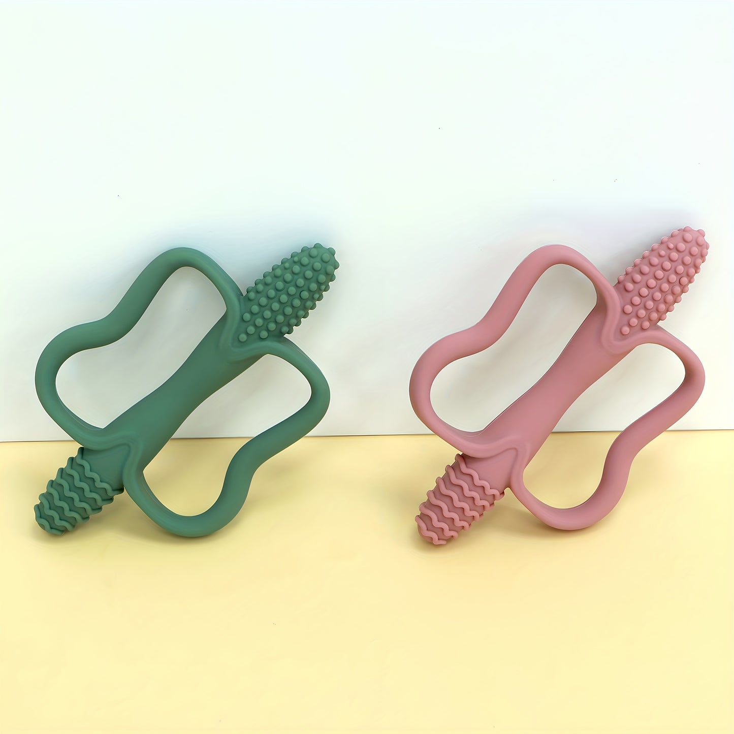 Corn-shaped teething stick with handle, available in 6 colors.