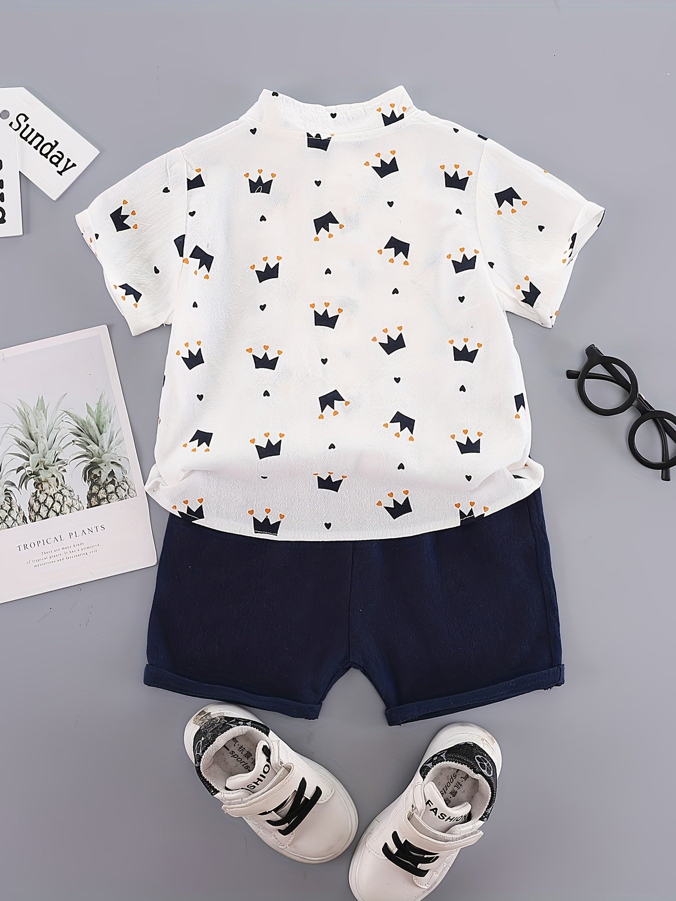 Boys' casual cotton short sets with button front stand collar shirt and shorts in geometric crown print. Made of non-stretch woven cotton-polyester blend for outdoor summer use.