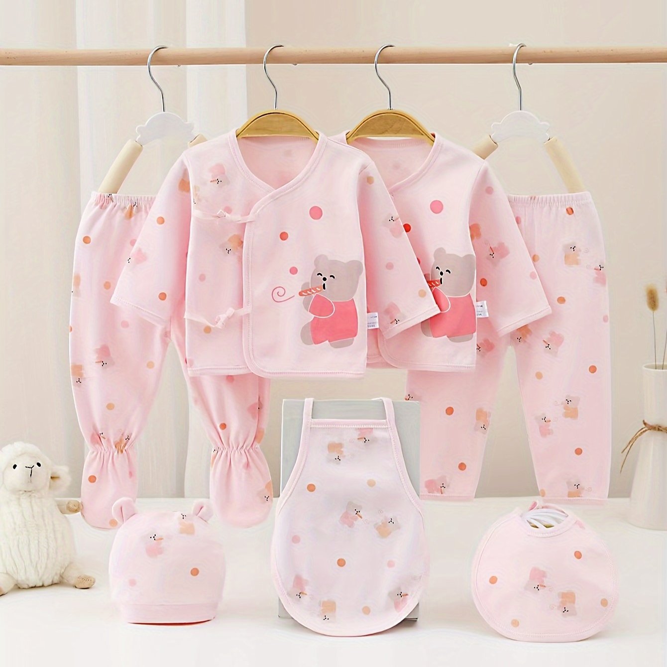 Comfy 7-piece cotton set for baby girl featuring bear and rabbit cartoons. Easy care and versatile wear.