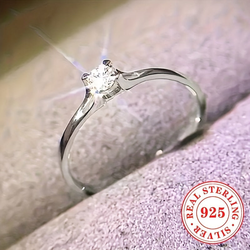 A woman purchased a 925 sterling silver engagement ring with a single stone zirconia, a simple yet elegant choice for her proposal and wedding day, a beautiful Valentine's Day gift.