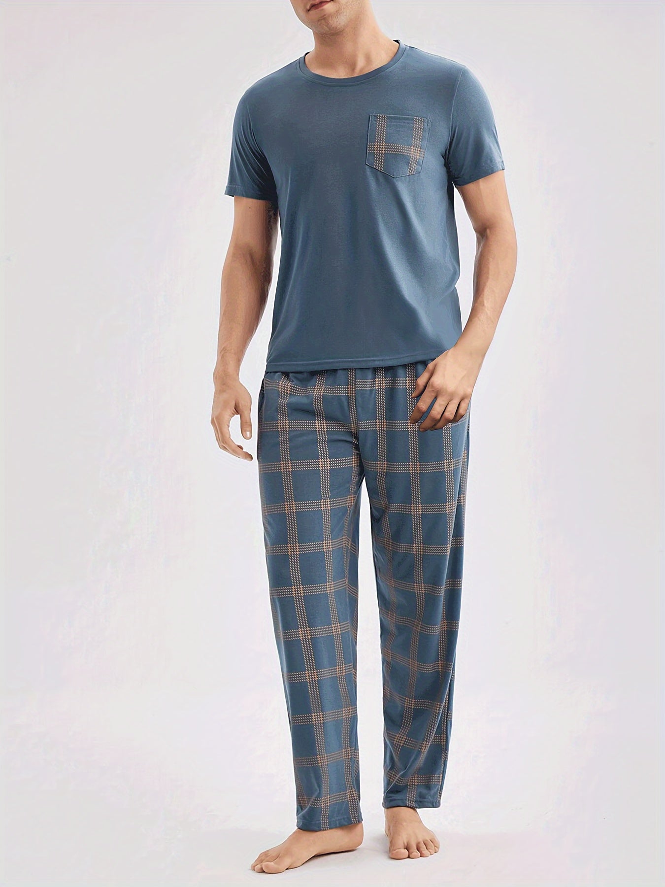 Men's casual blue short-sleeve top and plaid long pants set made of soft polyester for loungewear at home or out.