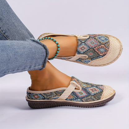 Women's printed slip-on mules with soft, lightweight soles.