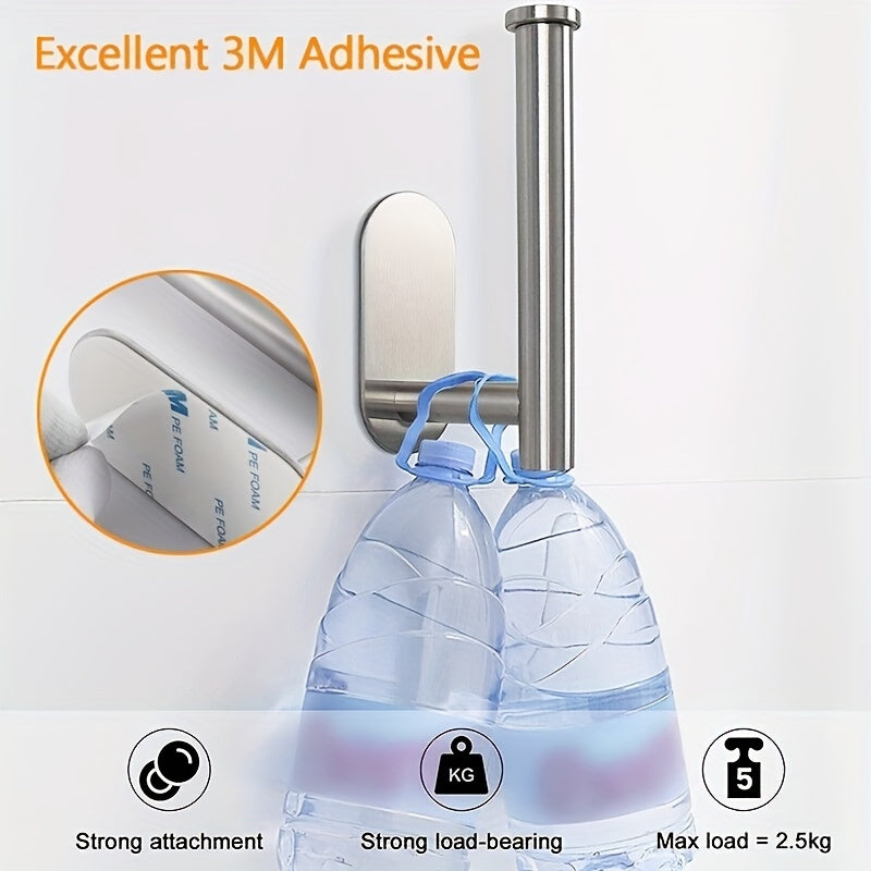 Stainless steel self-adhesive toilet paper holder.