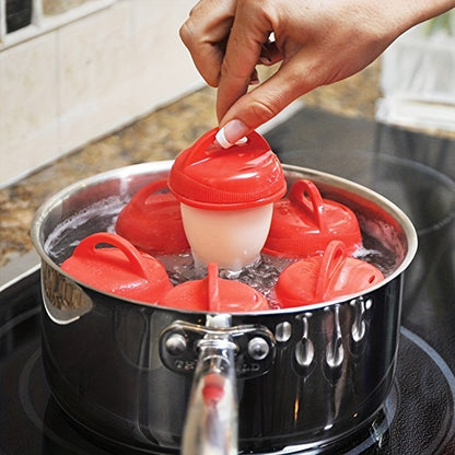 Red silicone egg cups for fluffy steamed eggs, perfect for home cooking and baking.