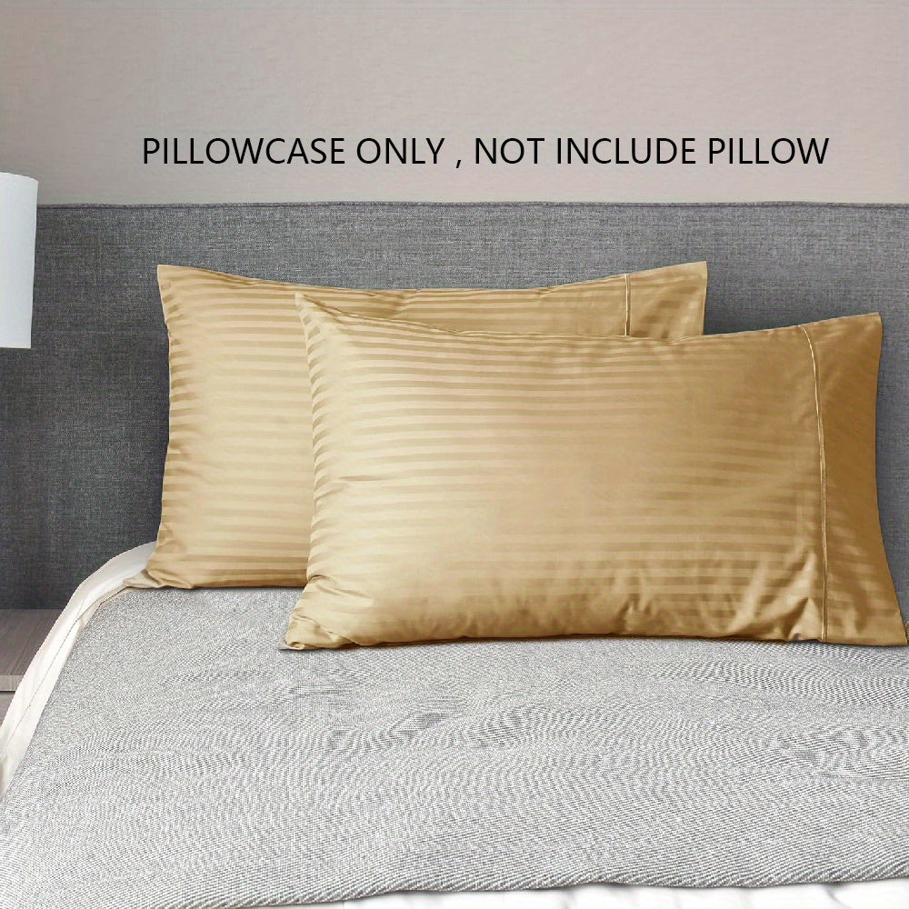 A pair of striped pillowcases made from soft, breathable woven polyester. These pillowcases are machine washable and have a sanded finish for added comfort. They do not include a pillow insert and are made from non-printed lightweight fabric with a 90gsm