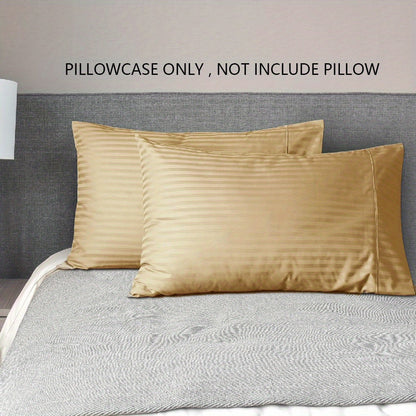 A pair of striped pillowcases made from soft, breathable woven polyester. These pillowcases are machine washable and have a sanded finish for added comfort. They do not include a pillow insert and are made from non-printed lightweight fabric with a 90gsm