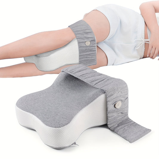 Memory foam knee pillow designed to promote proper body alignment and separate the knees for a more comfortable sleep. Perfect for side sleepers, this leg spacer pillow helps relieve back and knee pain. It is soft and comes with a strap for easy