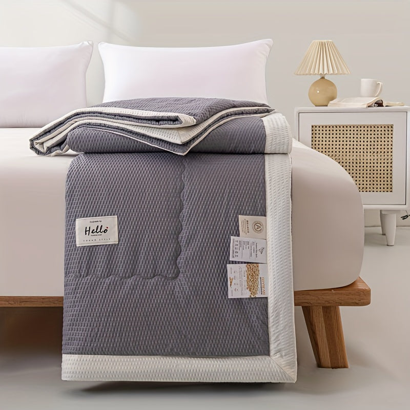 Ultra-soft lightweight summer quilt with cooling bean paste design for bedroom and guest room comfort, machine washable.