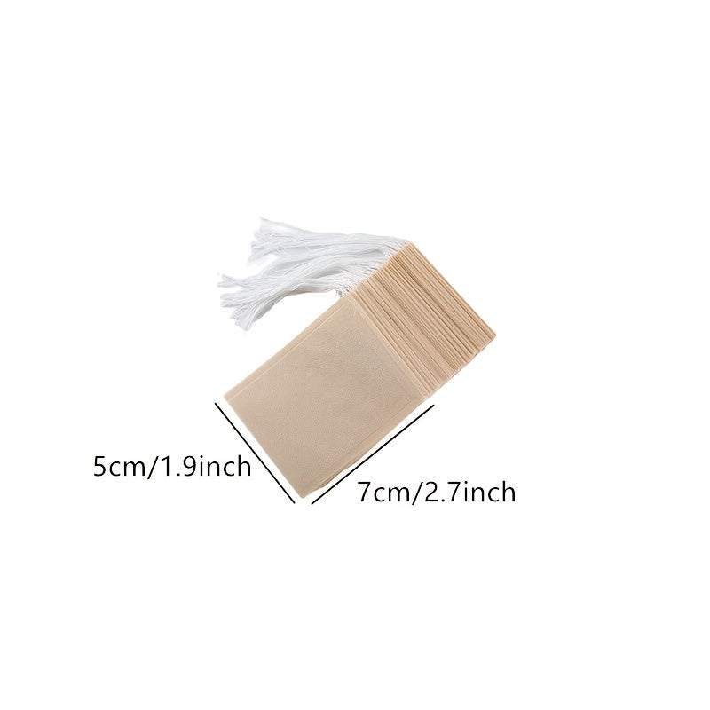 Pack of 100 Natural Biodegradable Drawstring Filter Paper Bags for Coffee, Tea, and Food - Convenient and Eco-Friendly - Disposable Tea Brewer and Empty Tea Bag infused with Pine Leaf Powder and Herbs - Ideal for Brewing and Serving