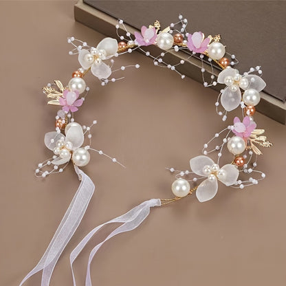 Romantic bridal headpiece with faux pearls, floral wreath, and ribbon tie.