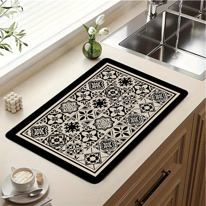 A necessary addition to any home, this retro-inspired printed tableware drying mat adds a touch of ethnic style to your kitchen. Perfect for keeping your kitchen utensils, coffee table, and coffee machine dry and clean, this versatile mat is a must-have