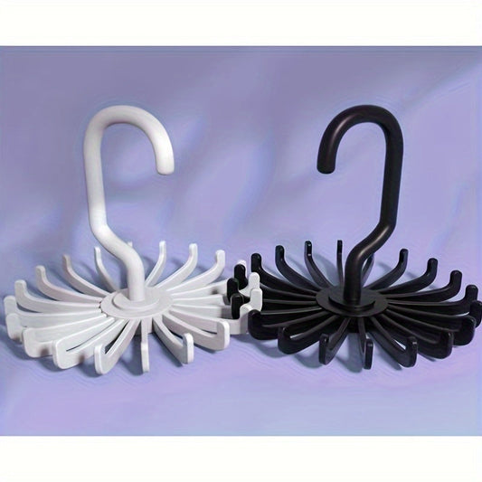 This versatile rotating clothes hanger is ideal for organizing scarves, belts, and everyday clothing. Simple to set up and great for hanging coats and hats. Made of durable plastic with a sleek, wall-mounted design.