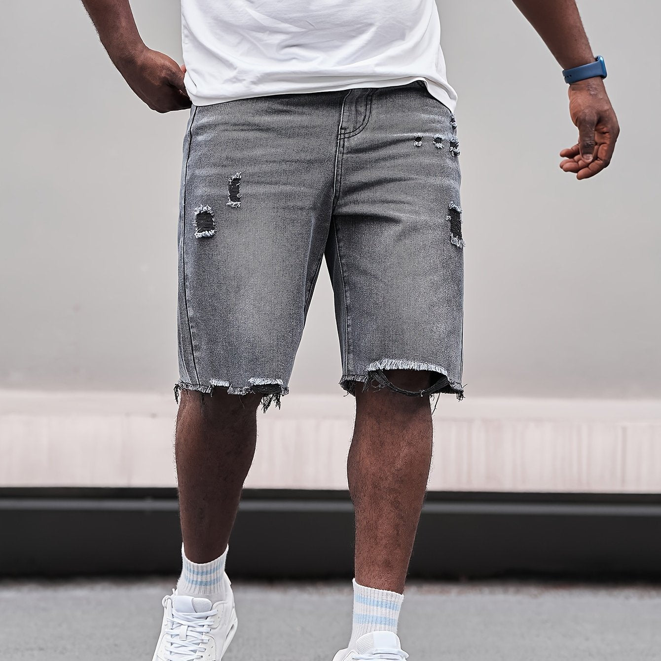 Relaxed fit cotton denim shorts for plus size men with a classic look for casual wear.