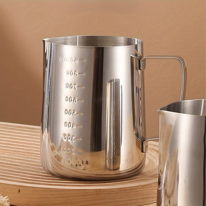 The Stainless Steel Coffee Art Cup is perfect for creating beautiful latte art, cappuccinos, and iced teas. Featuring convenient measurement marks and a large capacity, this milk frothing pitcher is available in 350ml, 600ml, and 900ml sizes.