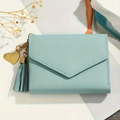 Compact trifold wallet for women with faux clutch coin purse, minimalist credit card holder, stylish tassel charm, and versatile for daily use.