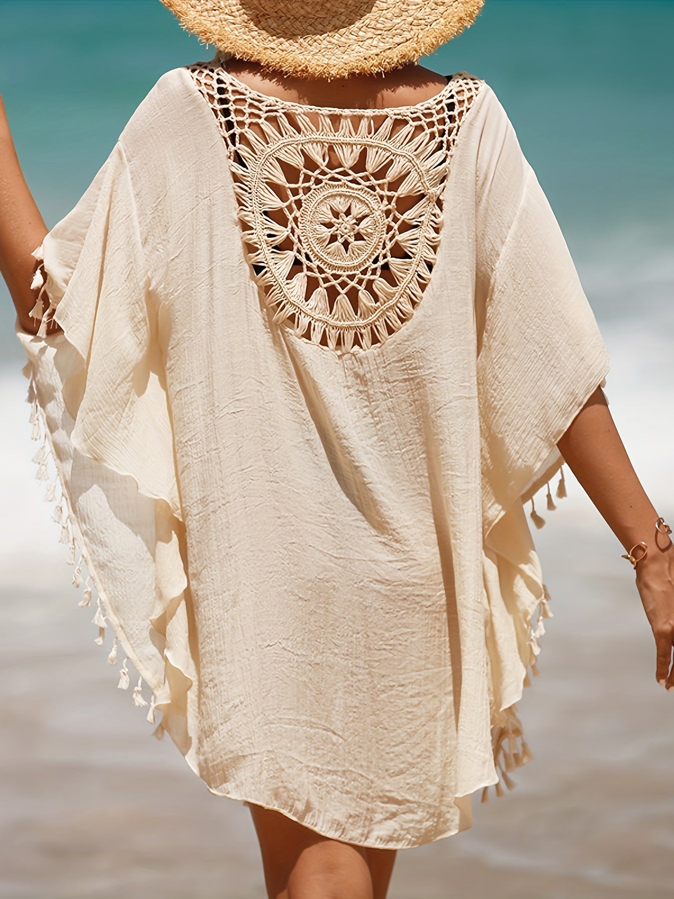 Women's casual beach vacation sunscreen shirt with solid-colored fabric spliced with small tassels for a sexy cover-up style.