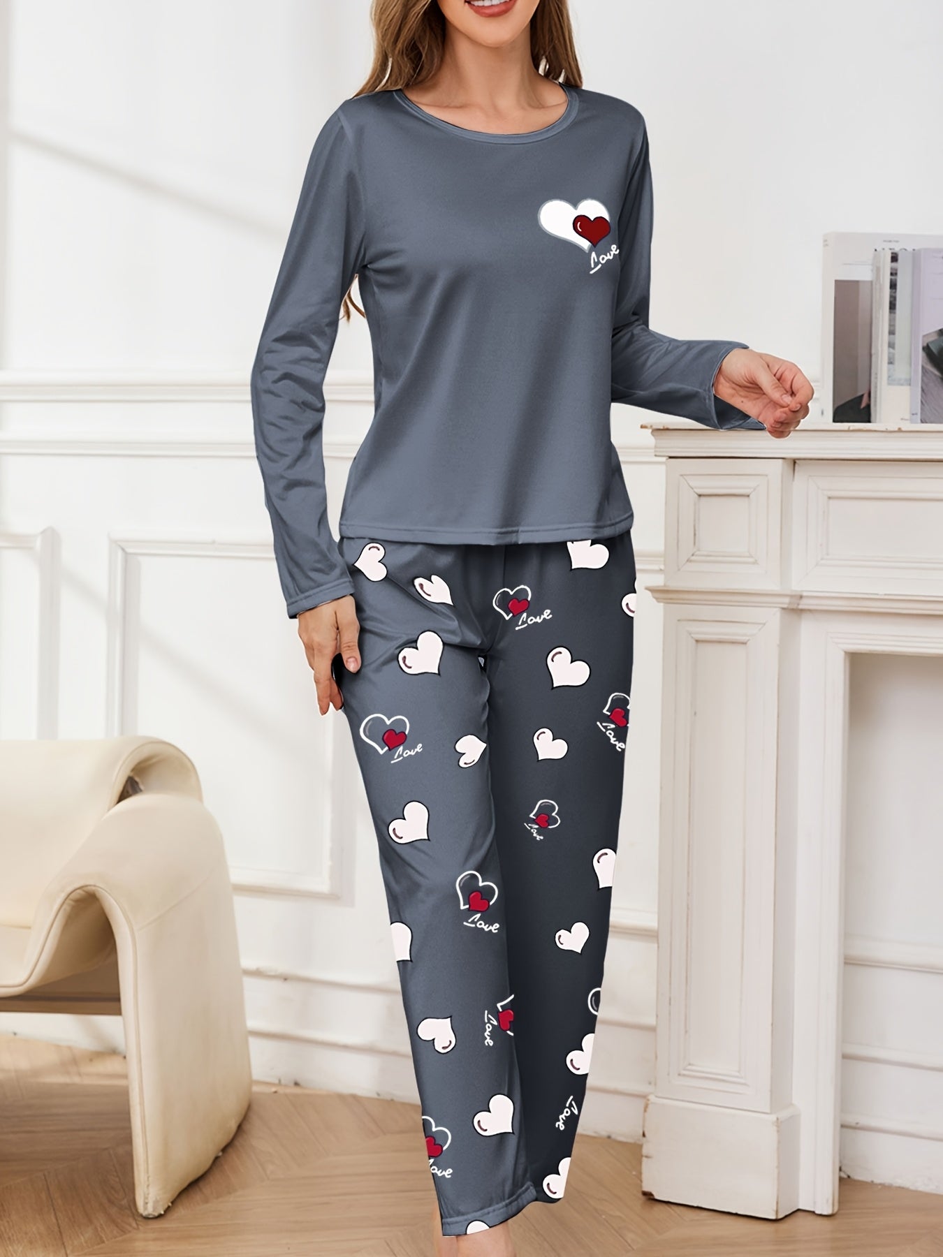 Women's pajama set for sleepwear and loungewear, featuring heart print, long sleeves, round neck top, and long pants for autumn and winter.