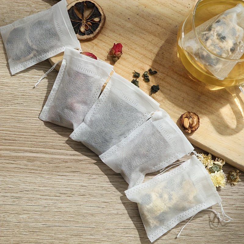 100 pieces of Disposable Drawstring Tea Bags for Loose Leaf Tea, perfect for use in restaurants, hotels, family gatherings, theme parties, weddings, and birthday parties.