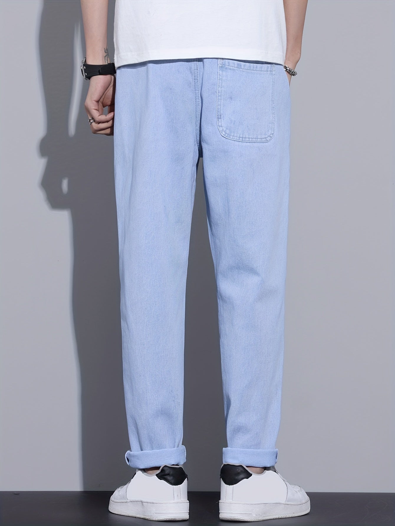 Men's light blue drawstring waist straight-leg jeans in glossy fabric, perfect for all seasons.