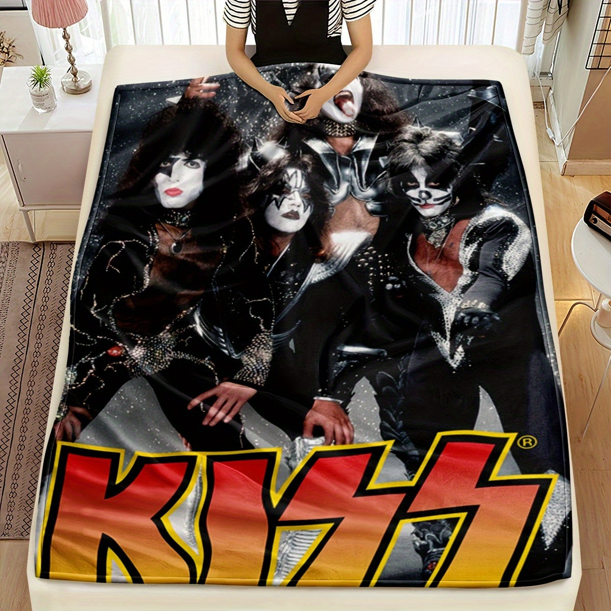 Add a touch of rock 'n' roll to your home with the KISS Rock Band-themed throw blanket. Made from knitted polyester, this lightweight blanket features a vibrant red and yellow gradient design, perfect for adding a contemporary style to your bedroom