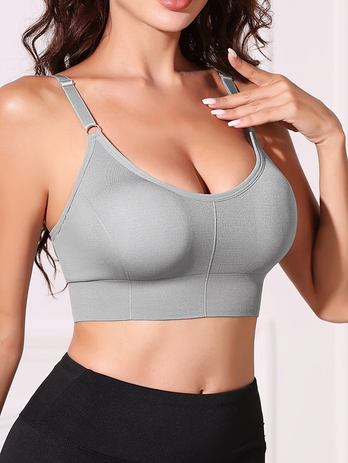 Gray wireless women's bra with removable pads, comfortable nylon blend, adjustable straps, backless design, and breathable fabric.