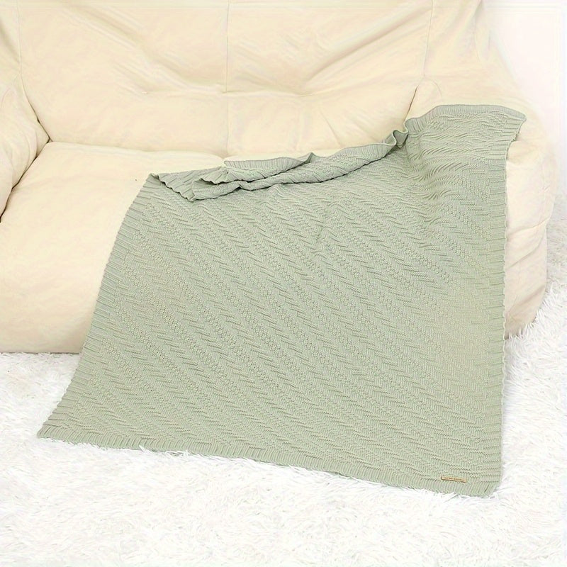 Soft, solid color blanket perfect for home and travel use, hand-knitted with care.