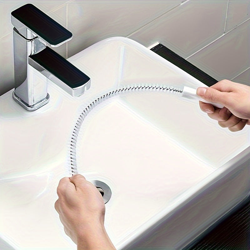 Non-electric, manual unclogging brush for flexible pipes in the bathroom.