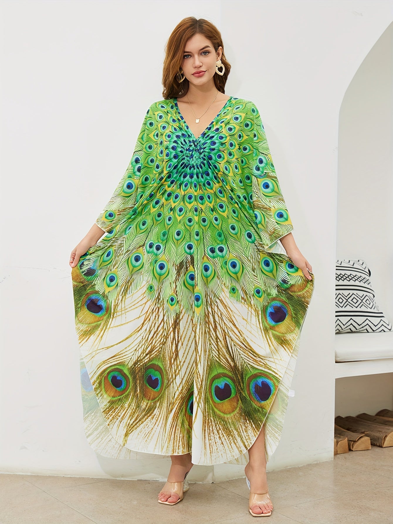 Handmade V-neck maxi beach dress in vibrant green, yellow, and blue peacock print, perfect cover-up for swimwear.