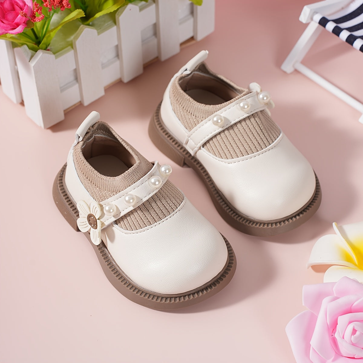 Pair of stylish baby shoes with flower bead accents, perfect for all seasons, including princess flats.