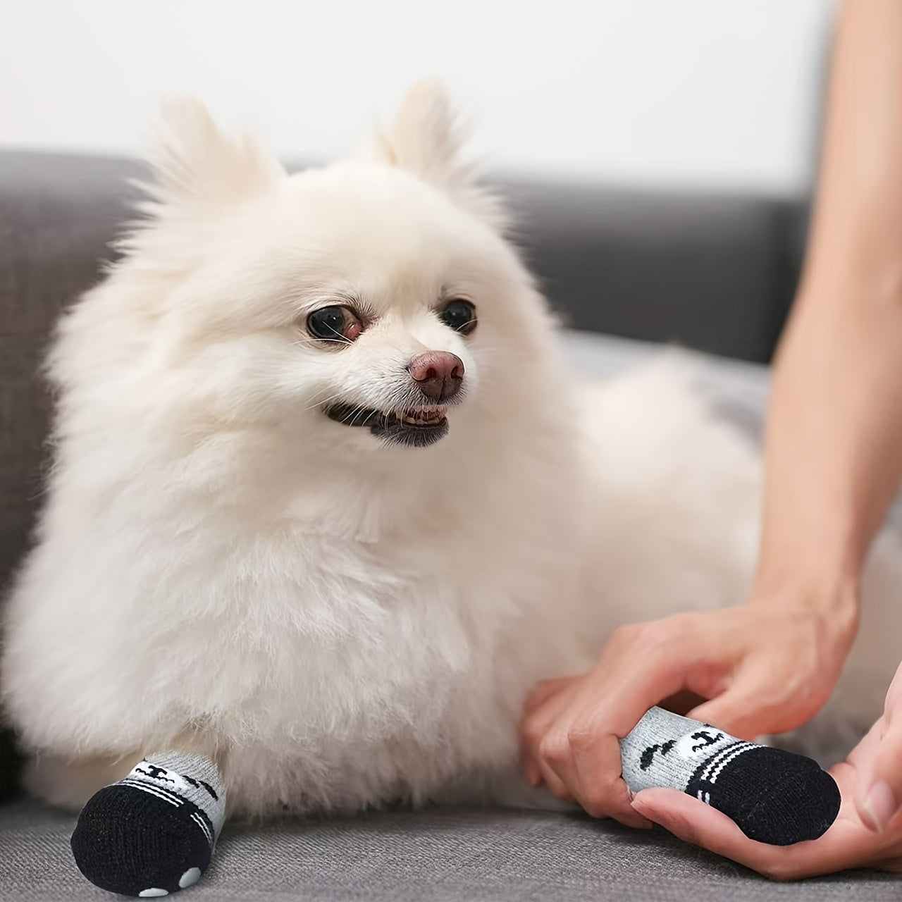 Waterproof dog socks with anti-slip rubber sole for all size pets, adjustable strap, durable polyester material. Perfect for outdoor use on hardwood floors. Reflective dog boots for safety.