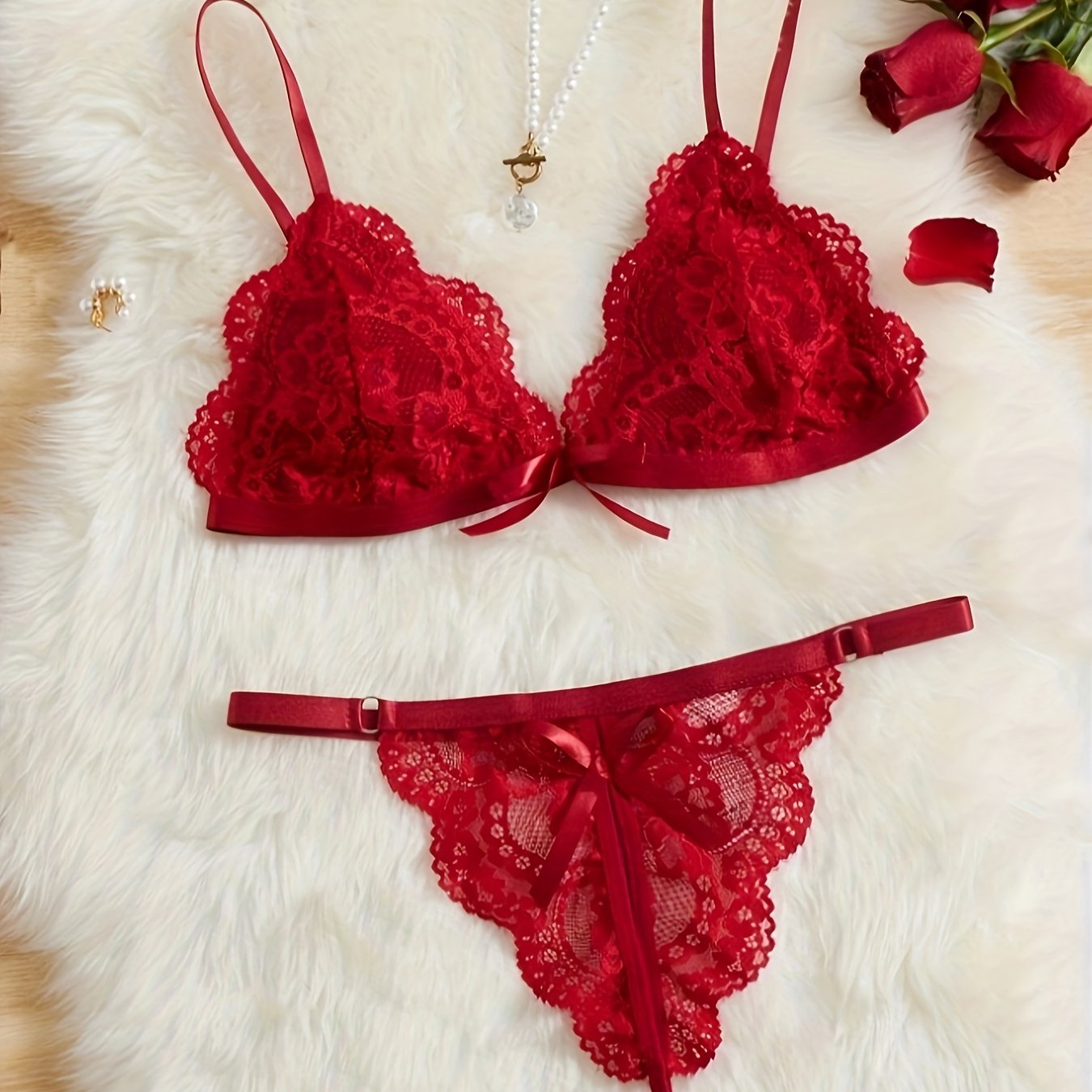 A women's lace lingerie set with a hollow design, open-crotch style, sexy bow detail, non-transparent bra, triangle cup shape, and Y2K style.