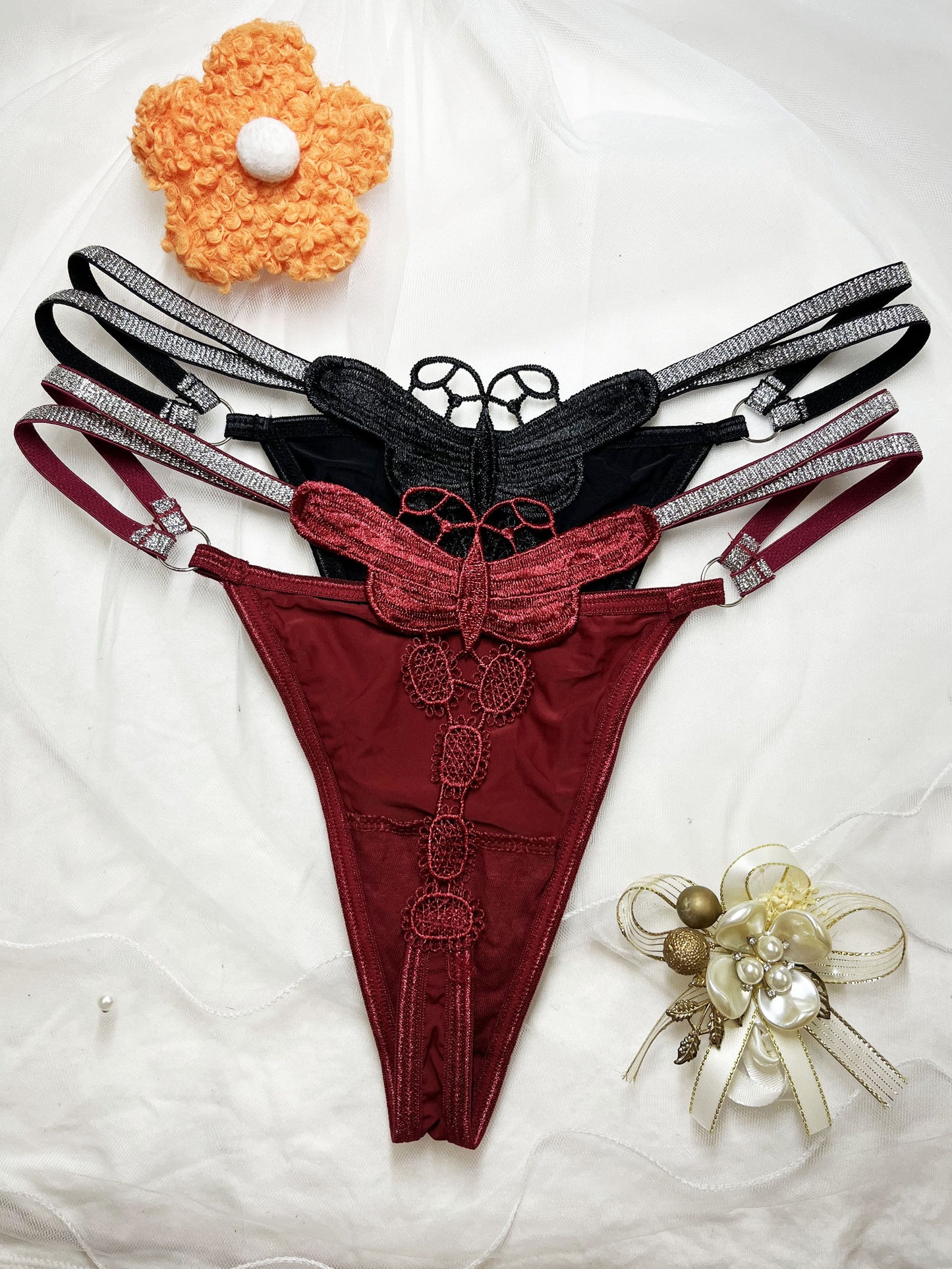 Glittery butterfly embroidered thong pants in two colors with a thin belt