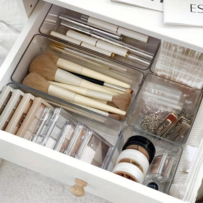 6-piece plastic makeup organizer set with stackable drawer dividers. Great for organizing makeup and office accessories without electricity needed.