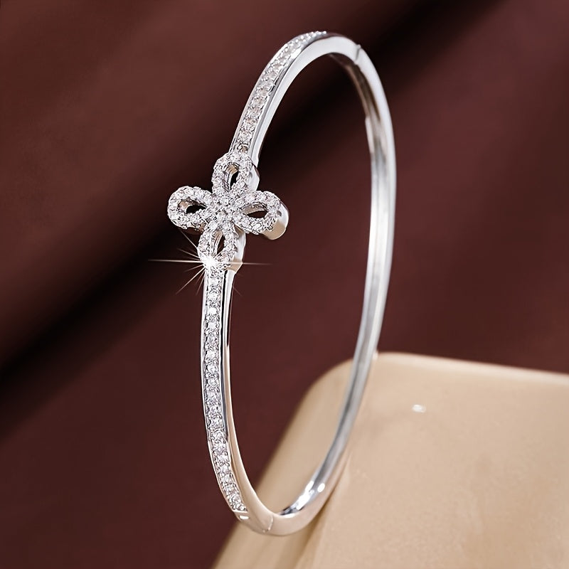 An exquisitely crafted bracelet designed for women, showcasing a delicate fireworks design adorned with synthetic zirconia.